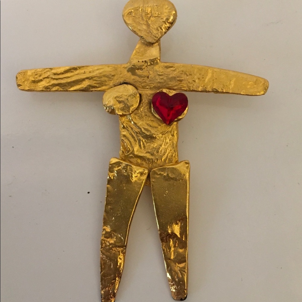 Female figure pendant.  Gold with red heart created by Joanne Cooper in 1980s